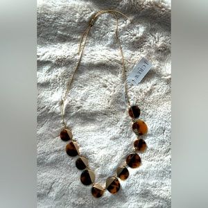 JCrew tortoise shell and gold style necklace with adjustable closure.